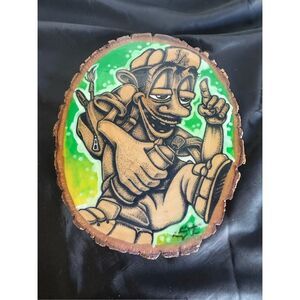 Drawing picture of graffiti artist from LA on wood ￼￼